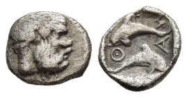 ISLANDS OFF THRACE, Thasos. Hemiobol (Circa 412-404 BC). 

Obv: Head of bald and bearded Silenos right. 
Rev: Θ-Α-Σ-Ι.
Two dolphins, one above the oth...