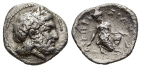 THESSALY. Kierion. Trihemiobol (Circa 350-325 BC). 

Obv: Laureate head of Zeus right.
Rev. KIEP-IEIΩИ.
Arne kneeling right, head left, playing with a...