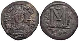 JUSTINIAN I (527-565). Ae Follis. Constantinople. Dated RY 13 (539/40).

Obv: D N IVSTINIANVS P P AVG. 
Helmeted and cuirassed bust facing, holding gl...