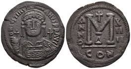 JUSTINIAN I (527-565). Ae Follis. Constantinople. Dated RY 14 (540/1).

Obv: Helmeted and cuirassed bust facing, holding globus cruciger and shield de...
