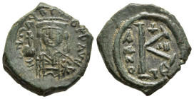 MAURICE TIBERIUS (582-602).Ae Half follis. Thessalonica.

Obv: Helmeted and cuirassed bust, holding globe and shield.
Rev. Large K, at sides, ANNO and...