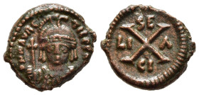 MAURICE TIBERIUS (582-602). Ae Decanummium. Syracuse. 

Obv: Helmeted, draped and cuirassed bust facing, holding globus cruciger.
Rev: Large X; SE - C...