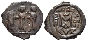 HERACLIUS with HERACLIUS CONSTANTINE and MARTINA (610-641). Ae Follis. Cyzicus. Dated year 18.

Obv: Heraclius standing facing between Heraclius Con...