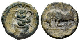 Ebusus. 1/4 calco. 200-100 BC. Ibiza. (Abh-923). Anv.: Bes wearing skirt, holding mace and snake. Rev.: Bull charging left. Ae. 3,66 g. Choice VF/VF. ...