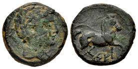 Kese. Half unit. 220-200 BC. Tarragona. (Abh-2312). Anv.: Male head right, spearhead behind. Rev.: Horse trotting right, below and between legs, pelle...