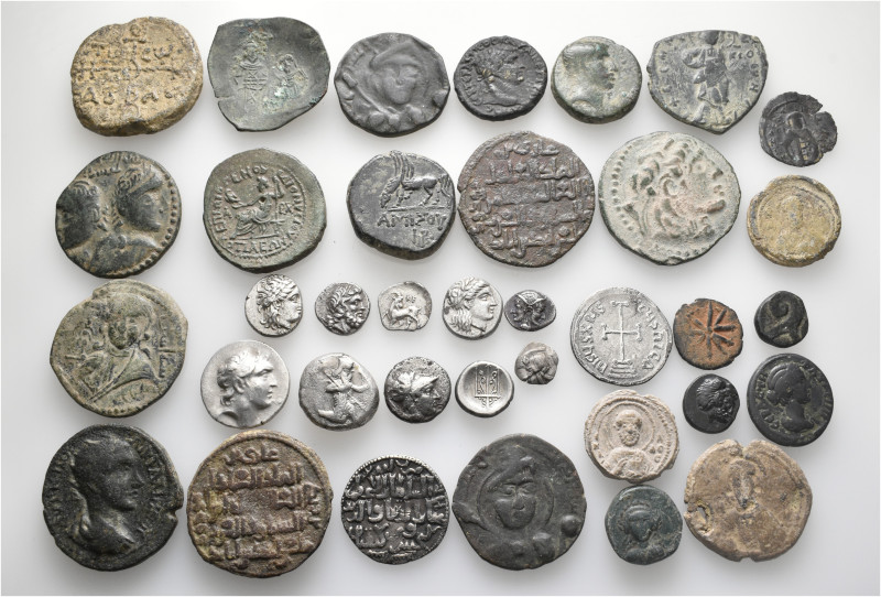 A lot containing 36 silver and bronze coins and lead seals. Including: Greek, Ro...