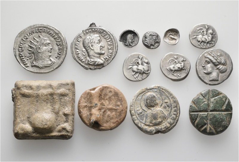 A lot containing 13 silver and bronze coins, weights and seals. Including: Greek...