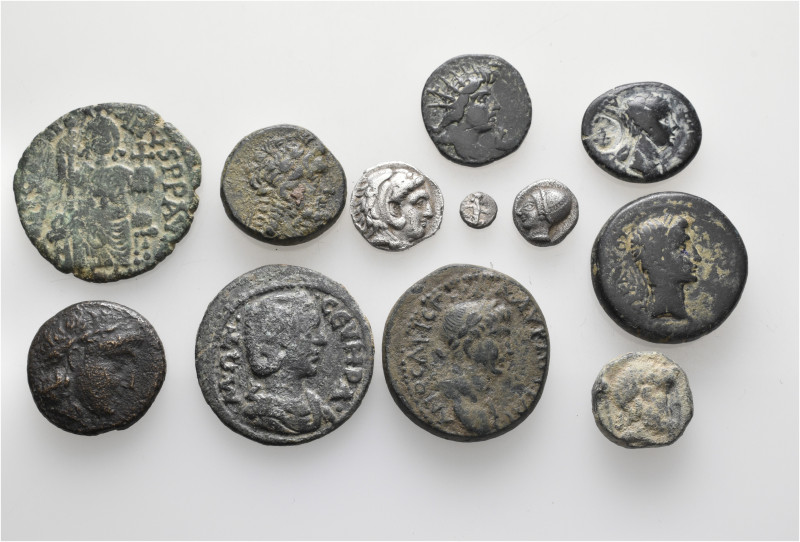 A lot containing 12 silver and bronze coins. Including: Greek, Roman Provincial ...