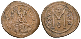 THEOPHILUS, 829-842 AD. AE, Follis. (31mm, 8.00 g) Constantinople. Obv: ✷ ΘЄOFIL ЬASIL. Crowned and draped bust facing, holding patriarchal cross and ...