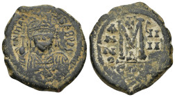 Maurice Tiberius. 582-602. Æ follis (28mm, 10.63 g). Constantinople, year 9 (590/1). Helmeted and cuirassed bust of Maurice Tiberius facing, holding g...