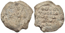 BYZANTINE LEAD SEALS. (32mm, 25.69 g). Obv: St. Philip standing facing, holding long cross and Gospels; palm frond to right. Rev: Legend five lines.