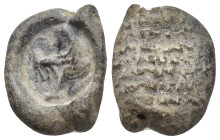 LEAD SEALS. (19mm, 5.79 g) Obv: Shepherd with ewe, perhaps milking her, both facing left. Rev: Legend in lines.