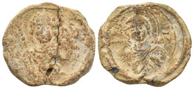 BYZANTINE LEAD SEALS. (24mm, 9.47 g). Obv: Facing bust of St. Demetrius, holding spear. Rev: Facing bust of the Virgin Mary.