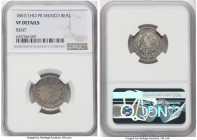 Republic Real 1867/1 Ho-PR VF Details (Bent) NGC, Hermosillo mint, KM372.7. A rare issue from this mint, which produced this denomination for only two...