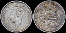 CYPRUS: 4-1/2 Piastres (1938) in silver (0,925). Crowned head of King George VI facing left on obverse. Two stylized rampant lions, denomination and d...