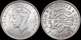 CYPRUS: 9 Piastres (1940) in silver (0,925). Crowned head of King George VI facing left on obverse. Two stylized rampant lions left, date at right, de...
