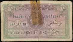 CYPRUS: 1 Shilling (30.8.1941) in brown and green. Portrait of King George VI at center on face. S/N: "C/3 652144". Worn, half-cut in the middle & tra...