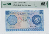 CYPRUS: 5 Pounds (1.7.1975) in blue on multicolor unpt. Arms at right on face. S/N: "Q/159 453258". WMK: Eagle head. Printed by (BWC). Inside holder b...