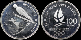 FRANCE: 100 Francs (1991) in silver (0,900) from the 1992 Olympics series. Ski jumpers on obverse. Crossed flame, date and denomination, logo of the O...