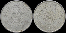 SAUDI ARABIA: 1 Riyal [AH1354 (1935)] in silver (0,917). Inscription within beadd circle, legend above, crossed swords below within design flanked by ...