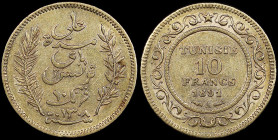 TUNISIA: 10 Francs (AH1308 / 1891 A) in gold (0,900). Legend flanked by sprigs on obverse. Value and date in center circle of ornate design on reverse...