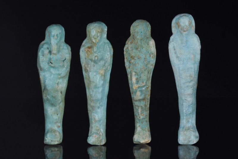 EGYPTIAN FAIENCE USHABTI GROUP
Late Period, 30th Dynasty, Ca. 332 BC. 
A group...