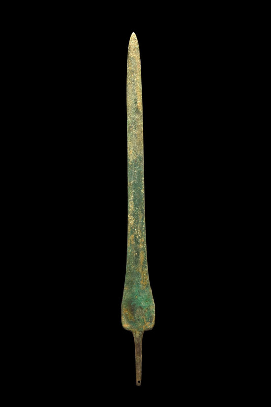 ANCIENT BRONZE LONG SPEARHEAD
Ca. 1200-700 BC. 
A beautiful cast bronze sword ...