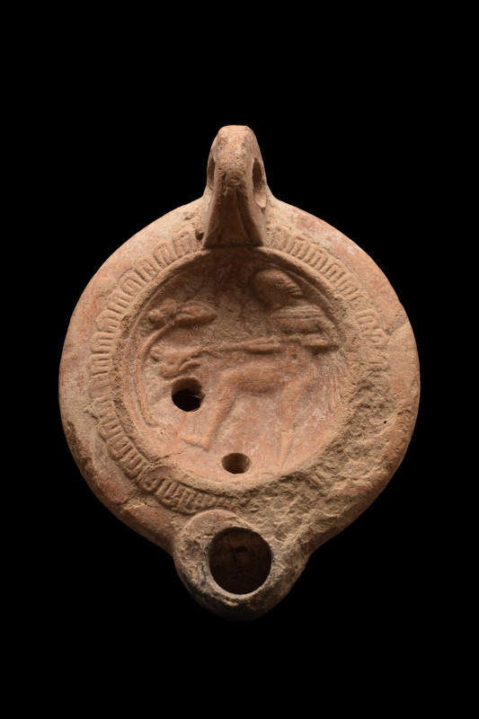 ANCIENT ROMAN TERRACOTTA OIL LAMP WITH HERCULES FIGHTING A BOAR
Ca. 1-200 AD. ...