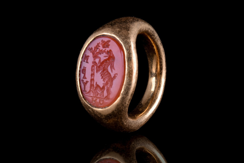 ROMAN GOLD RING WITH GOAT CARNELIAN INTAGLIO
Ca. 100-300 AD. 
The ring feature...