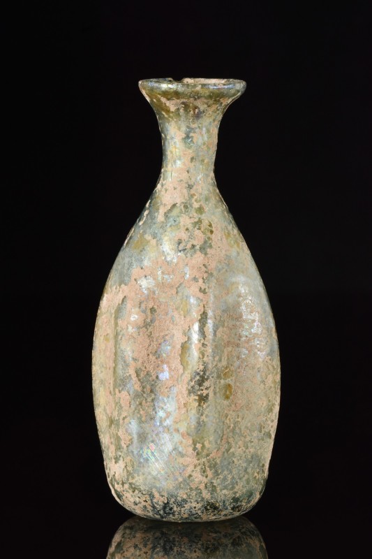 ANCIENT ROMAN GLASS BOTTLE
Ca. 100-200 AD.
A blown glass flask, featuring a bu...