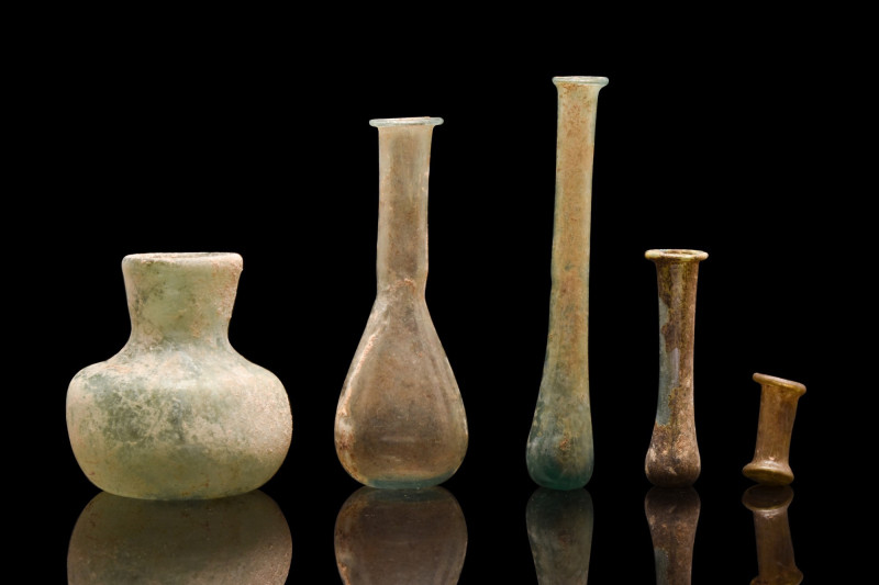 ANCIENT ROMAN GLASS COLLECTION OF FIVE FLASKS
Ca. 100-300 AD. 
A fine group of...