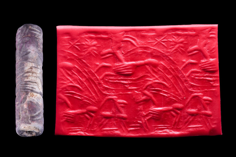 EARLY NEO-BABYLONIAN STONE CYLINDER SEAL
Ca. 1100-600 BC. 
An elaborately carv...