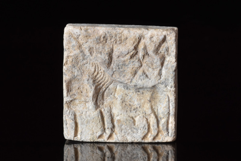 INDUS VALLEY STEATITE SEAL
Ca. 2500-1800 BC. 
A square-shaped steatite seal wi...