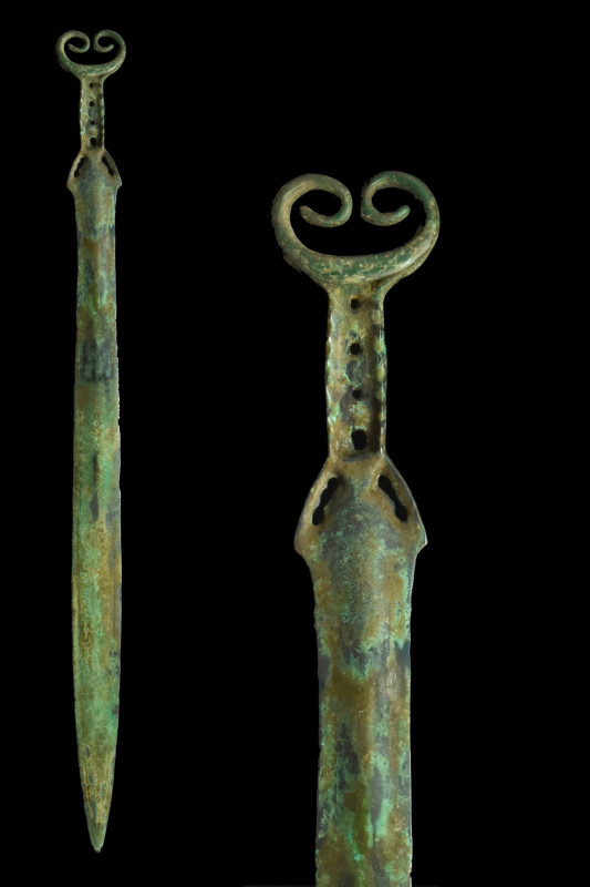 AN ELABORATE CELTIC BRONZE SWORD
Ca. 1000-800 BC. 
The long blade gently broad...