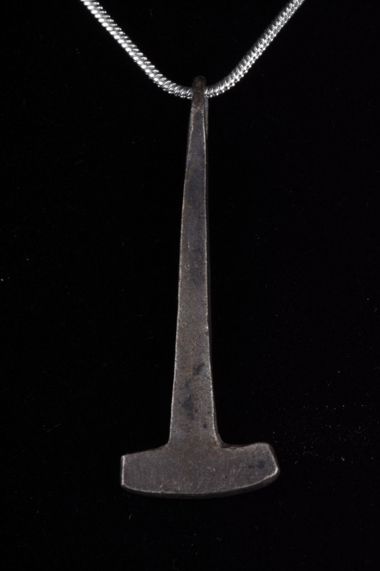 VIKING AXE PENDANT
Viking Age, Ca. 700–900 AD. 
A silver amulet of a stylised ...