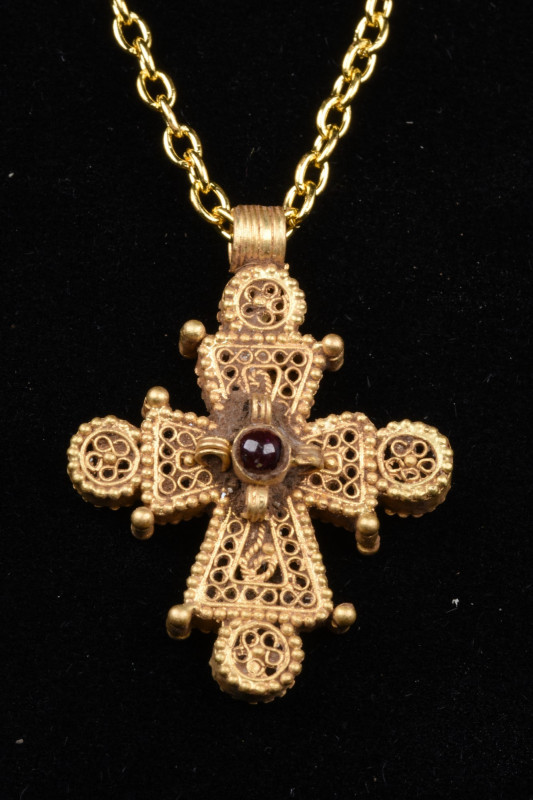 BYZANTINE GOLD AND GARNET CROSS
Ca. 1200–1400 AD. 
A stunning openwork Byzanti...