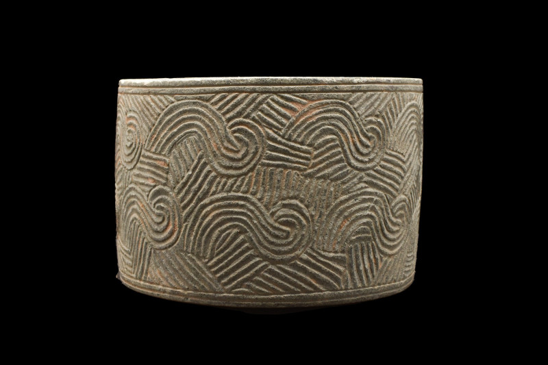 BACTRIAN SCHIST CYLINDRICAL VESSEL
Ca. 4000 BC. 
A schist stone vessel with a ...