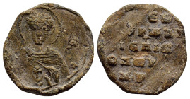 BYZANTINE LEAD SEALS. (19mm, 5.3 g). Obv: Facing bust of uncertain saint. Rev: Legend five lines.