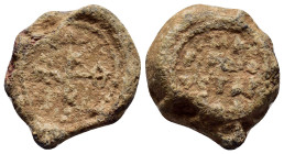BYZANTINE LEAD SEALS. (20mm, 10.4 g). Obv: Cruciform monogram. Rev: Legend three lines.