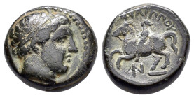 KINGS of MACEDON. Philipp II (359-336). Ae.

Obv : Diademed head of Apollo right.

Rev : ΦΙΛΙΠΠΟΥ.
Youth on horse rearing left, N monogram below. 
SNG...