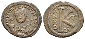 JUSTINIAN I (527-565). Half Follis. Antioch.

Obv : D N IVSTINIANVS P P AVG.
Helmeted, draped and cuirassed bust facing, holding globus cruciger and s...