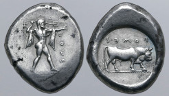 Lucania, Poseidonia AR Stater. Circa 470-445 BC. Poseidon advancing to right, wielding trident; ΠΟMΕ retrograde and downwards before / Bull standing t...