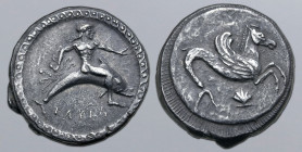 Calabria, Tarentum AR Nomos. Circa 490-480 BC. Taras astride dolphin to right, holding octopus; TAPAΣ below / Hippocamp swimming to right; scallop she...