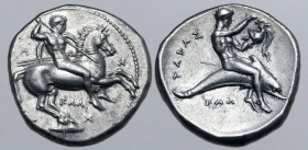 Calabria, Tarentum AR Nomos. Circa 340-325 BC. Kal-, magistrate. Nude rider on horseback to right, holding lance in right hand and shield with two jav...