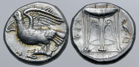 Bruttium, Kroton AR Stater. Circa 350-300 BC. Eagle with wings displayed and head raised, standing to left holding hare; AI below / Tripod-lebes, with...