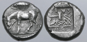 Thessaly, Larissa AR Drachm. Circa 479-460 BC. Horse grazing to left, with head lowered; above, cicada to left / Sandal of Jason to left, double axe a...