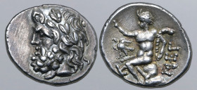 Arkadia, Megalopolis AR Triobol or Hemidrachm. Circa 100-80 BC. Laureate head of Zeus to left / Pan seated to left on rock, raising hand and holding l...