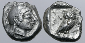 Attica, Athens AR Tetradrachm. Circa 500-480 BC. Archaic head of Athena to right, wearing crested helmet decorated with chevron and dot pattern and ro...