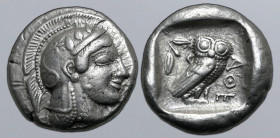 Attica, Athens AR Tetradrachm. Circa late 470s BC. Head of Athena to right, wearing earring and crested Attic helmet decorated with spiral palmette an...