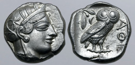 Attica, Athens AR Tetradrachm. Circa 454-404 BC. Head of Athena to right, wearing crested Attic helmet ornamented with three olive leaves above visor ...